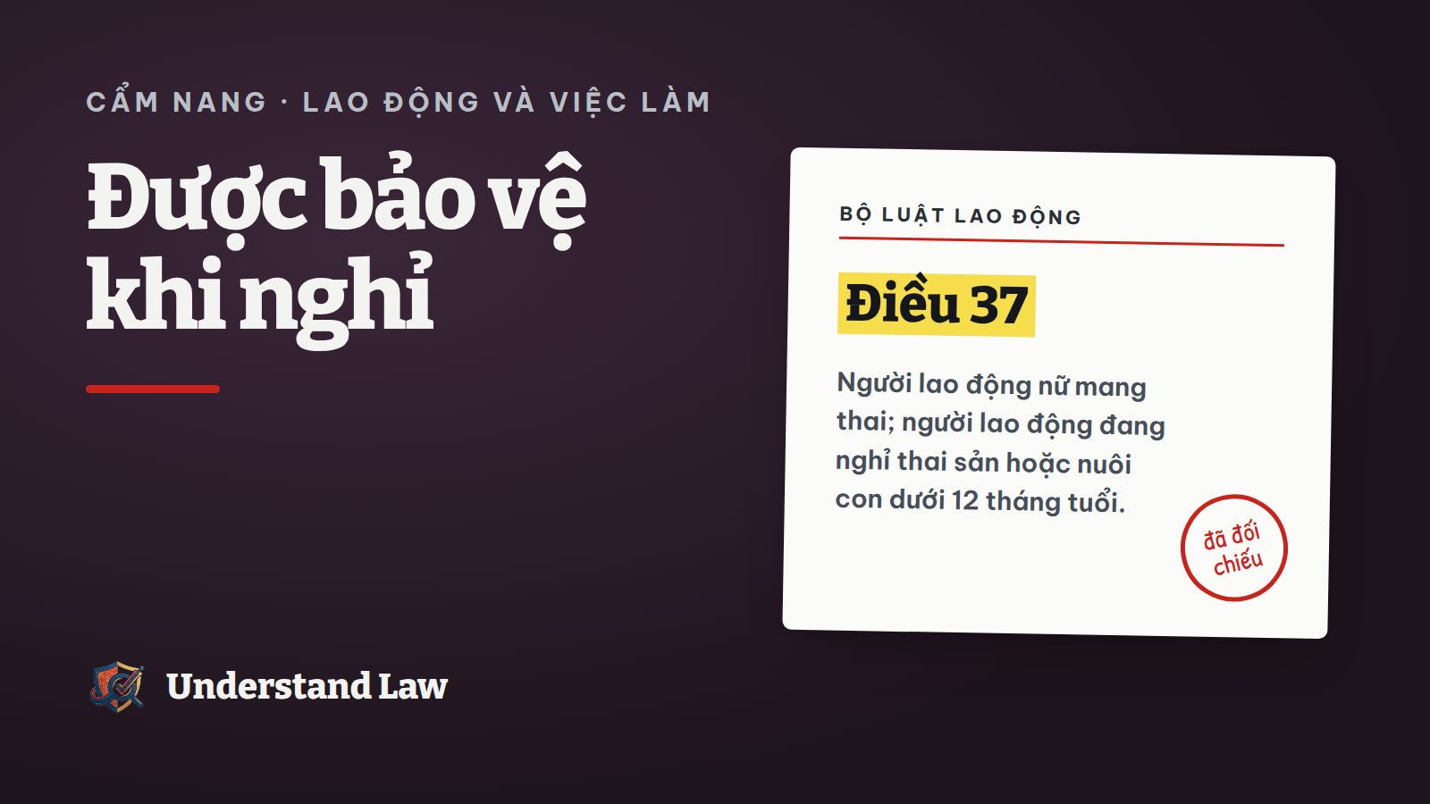 Người mẹ bế con nhỏ đứng cạnh tấm khiên bảo vệ